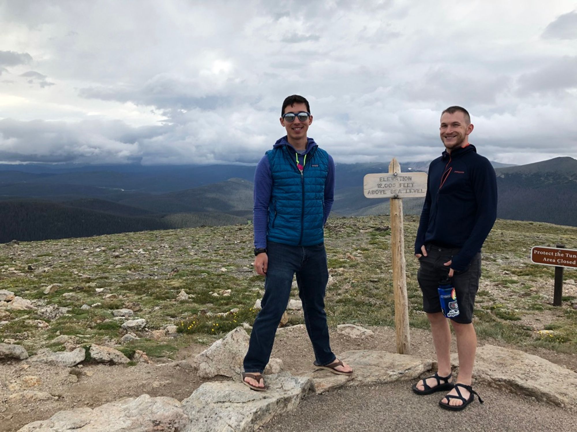 Me and Josh, standing in front of a small sign that says