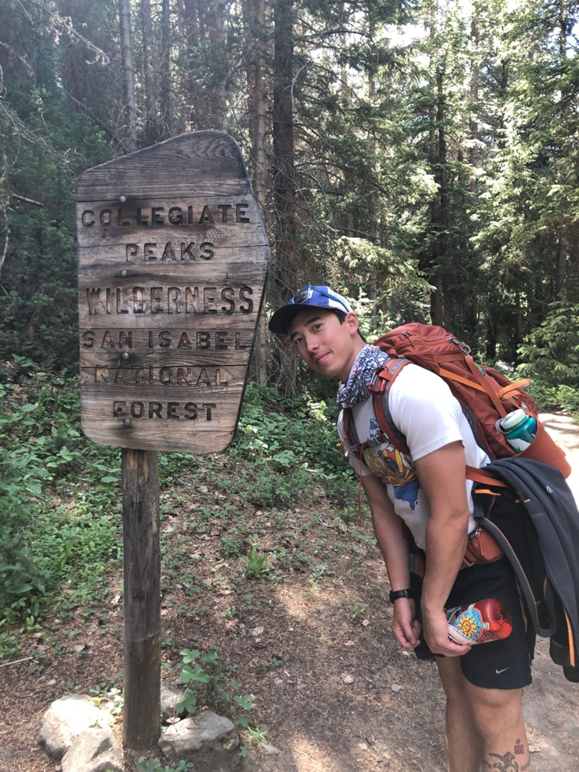 Josh posing with a sign indicating our entry to the Collegiate Peaks Wilderness